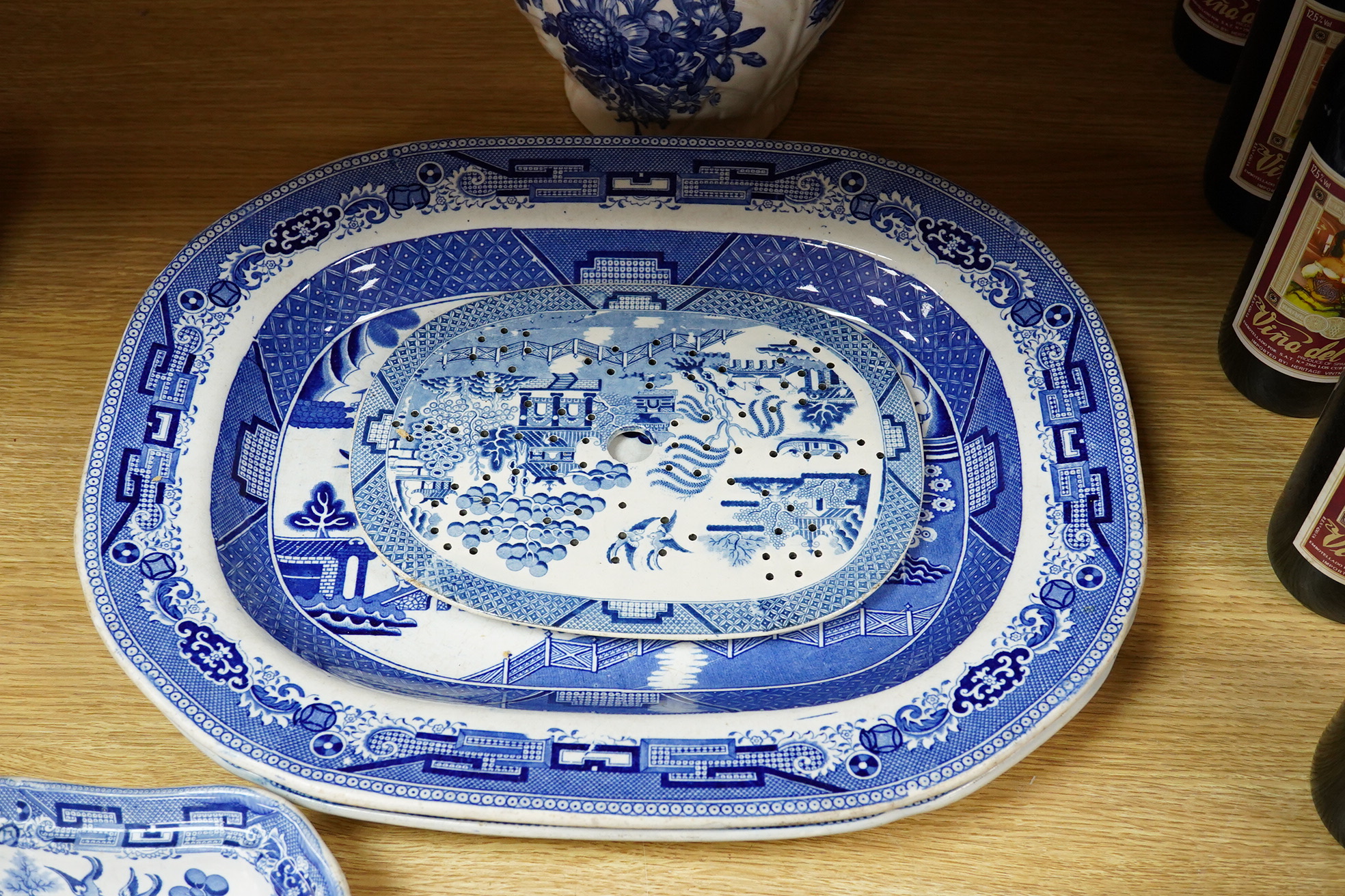 A quantity of Victorian blue and white pottery and a large Worcester jug, meat platters 45cm wide